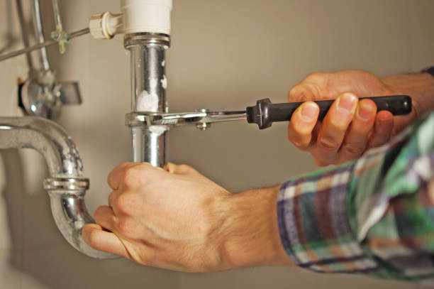 plumber at work in the bathroom